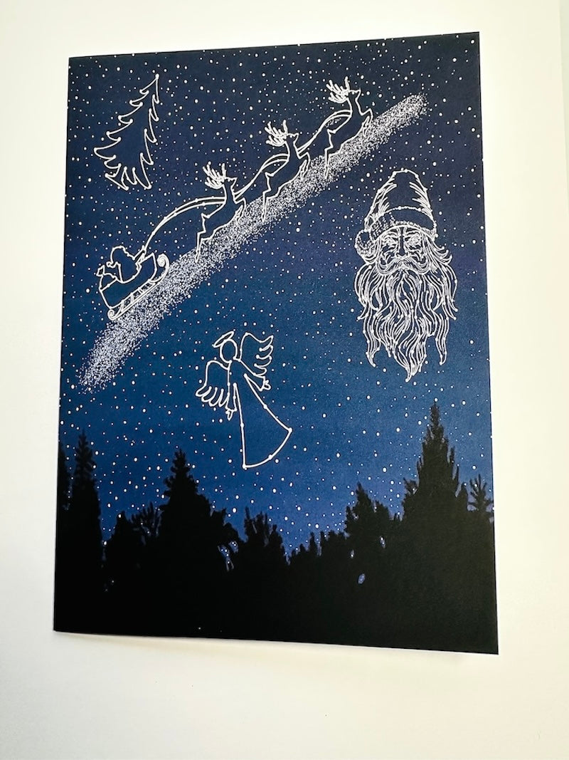 Celestial Night Sky with Santa Face, an Angel, Santa's Sleigh with Reindeer, and Christmas Tree in stars, Christmas Holiday Greeting Card with Red Envelope