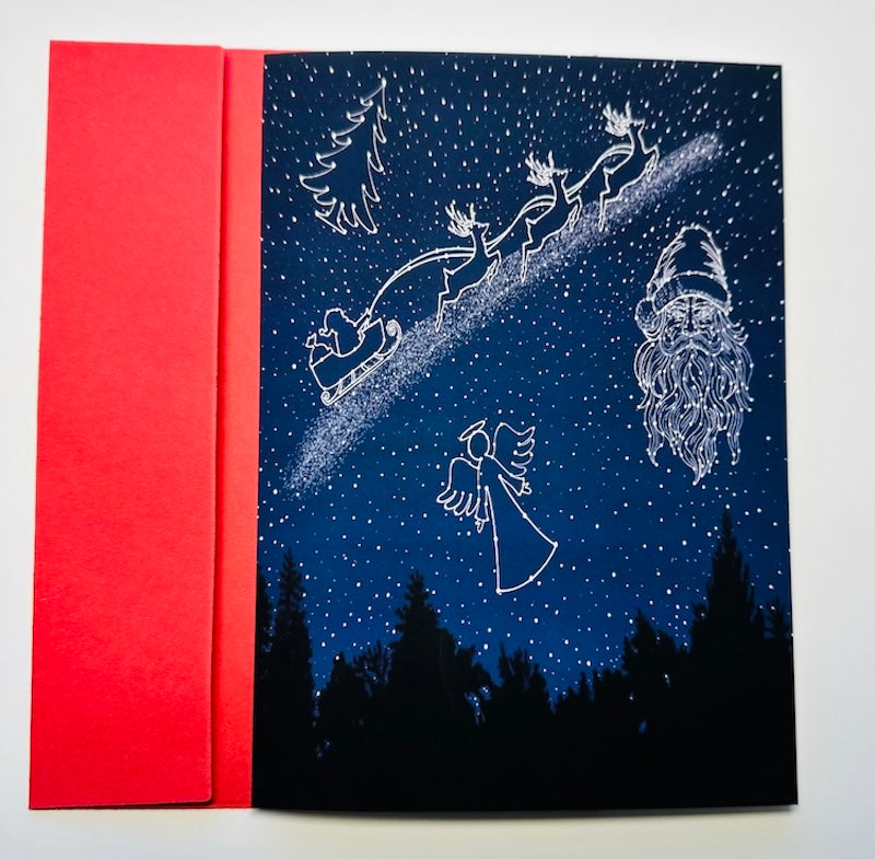 Celestial Night Sky with Santa Face, an Angel, Santa's Sleigh with Reindeer, and Christmas Tree in stars, Christmas Holiday Greeting Card with Red Envelope