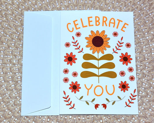 Hand illustrated Greeting card with floral design and 'Celebrate You' text on a textured surface