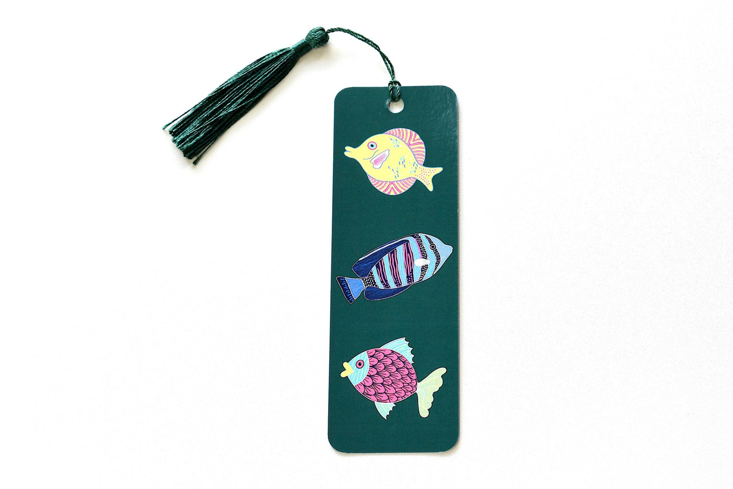 Bookmark with colorful fish illustrations on a green background
