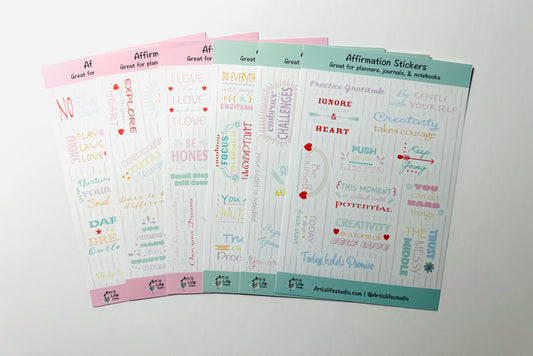 2 Sets of affirmation stickers, one pink set and one green set on a white background