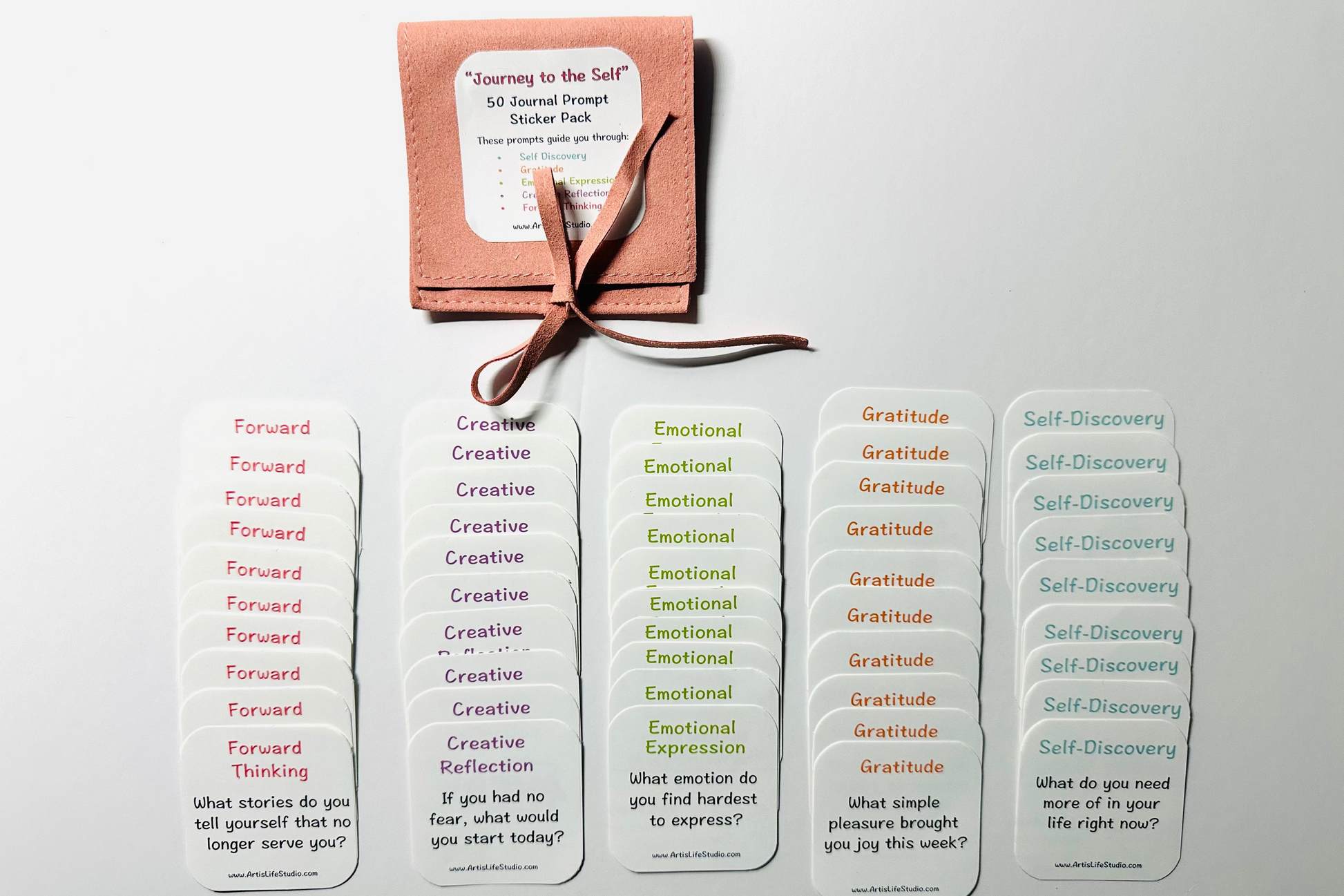 Set of journal prompt sticker pack with a pink faux suede packaging on a white background