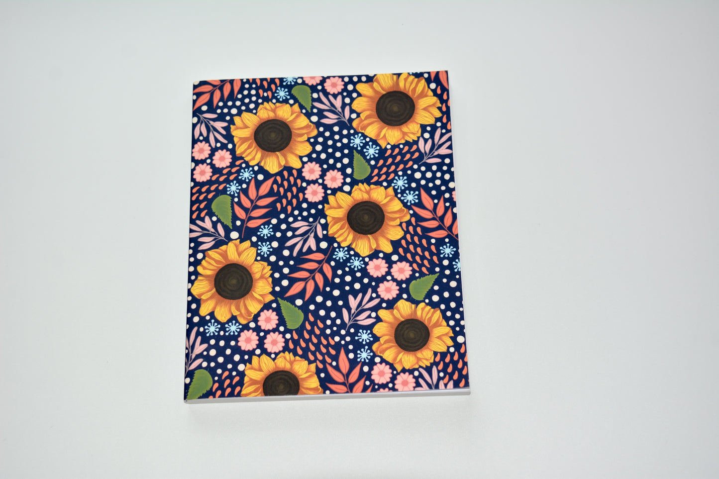 Sunflower Floral patterned notebook on a navy blue background
